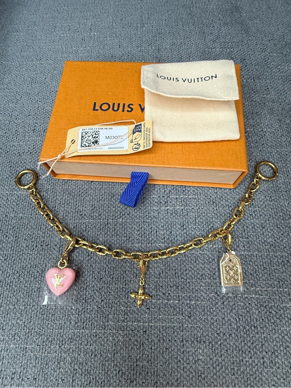 Louis Vuitton bag charm with removable charms